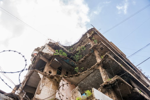 War damage. Building full of bullet holes and war scars in Beirut, Lebanon.