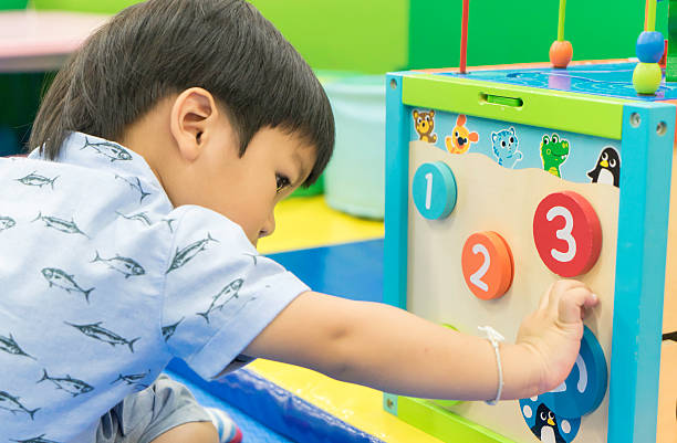istock Asian Boy is playing counting educational toy 510563836
