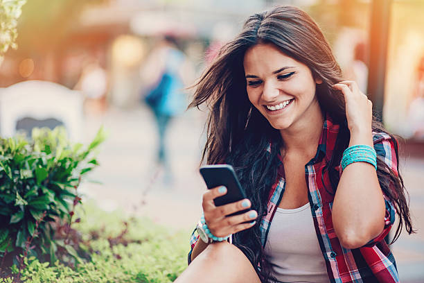 istock Smiling woman texting 510563888