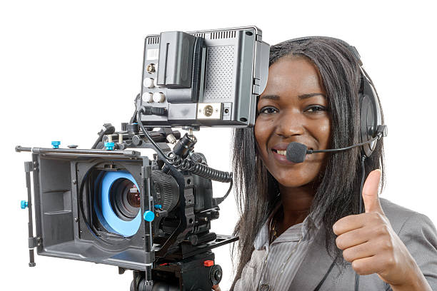 istock young African American women with professional video camera and 510565202