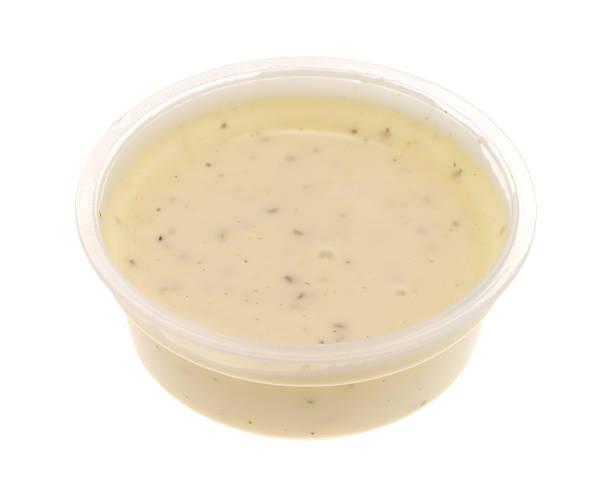 istock Container of ranch dressing on a white background 510566048
