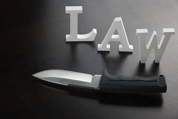 istock White Sign Law And Knife on the  Black Background 510566656