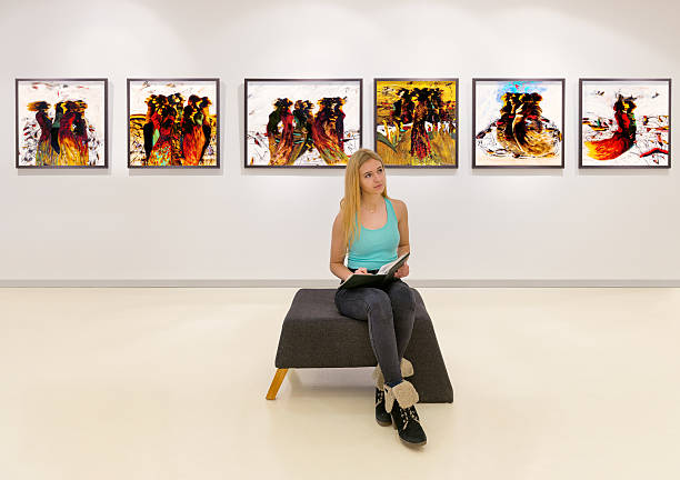 istock Young woman visits an art gallery 510566974