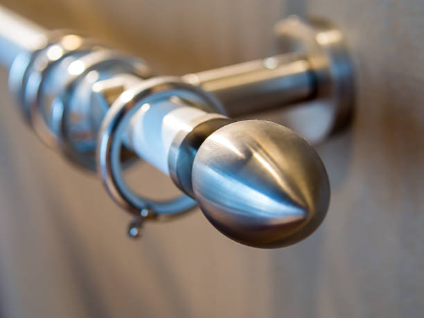 Stainless curtain rod on the wooden wall stock photo