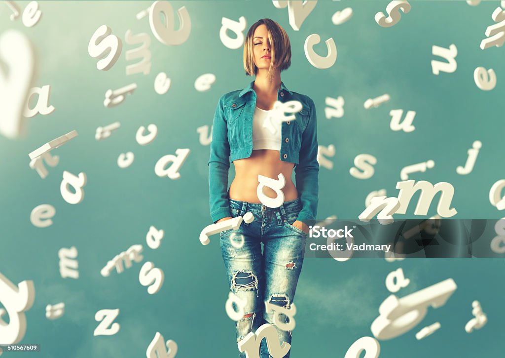 Sexy young woman Sexy young woman in a trendy clothes with letters flying arround her Adult Stock Photo