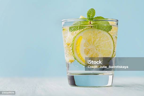 Mineral Infused Water With Limes Lemons Ice And Mint Leaves Stock Photo - Download Image Now