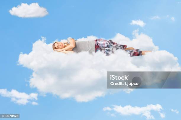 Tranquil Scene Of A Woman Sleeping On Cloud Stock Photo - Download Image Now - Sleeping, Cloud - Sky, Women
