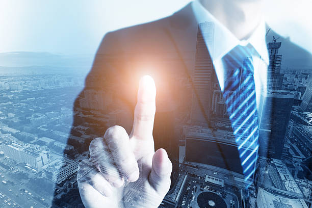 istock City double exposure concept with businessman finger pointing 510570982