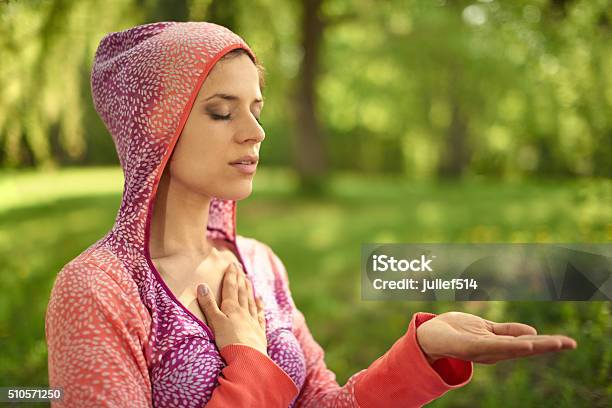 Serene And Peaceful Woman Practicing Mindful Awareness Mindfulness By Meditating Stock Photo - Download Image Now