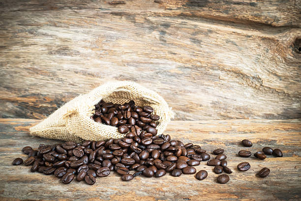 istock coffee bean on wood background 510571624