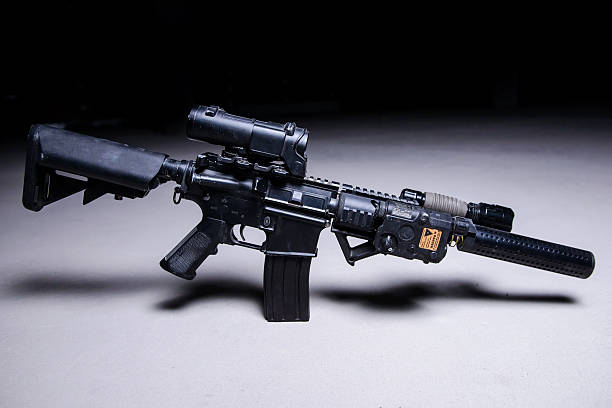 istock Assault rifle with silencer and optical scope 510571926
