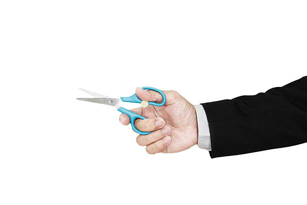 istock Hand holding scissor, selective focus, isolated on white background 510573356