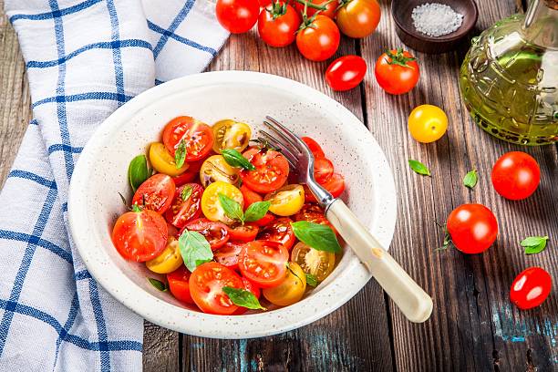 istock Salad of organic cherry tomatoes with basil 510573496