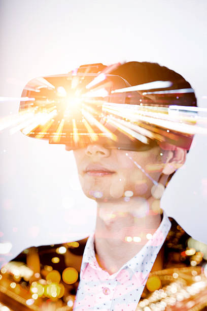 istock Double exposure of man wearing virtual reality headset 510573528