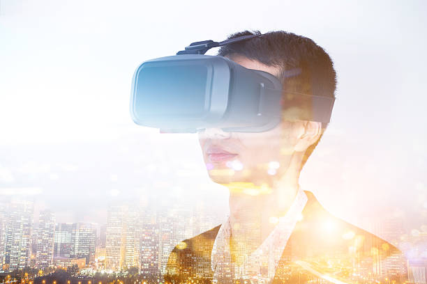 istock Double exposure of man wearing virtual reality headset 510573718