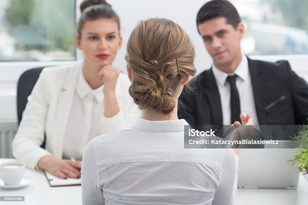 Applicant and recruitment procedure Young woman and recruitment procedure in corporation Job Interview Stock Photo