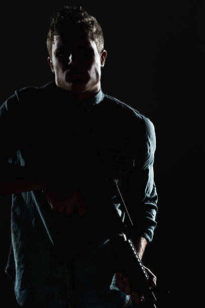 istock Casual man holding rifle 510576260