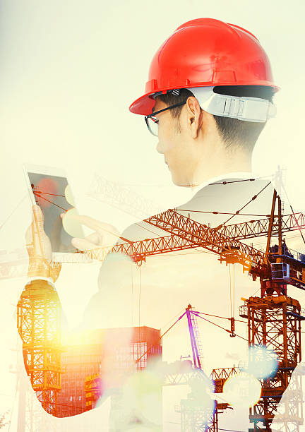 istock Double exposure of city and architect using digital tablet 510576792