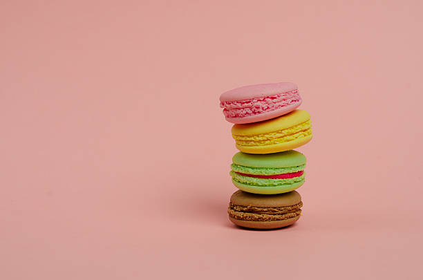 istock Couple pink macaroons lying on pink background 510577716
