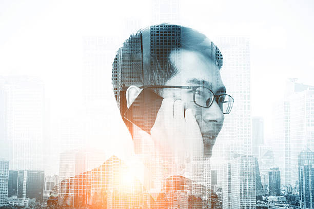istock Businessman talking on the phone double exposure 510579148
