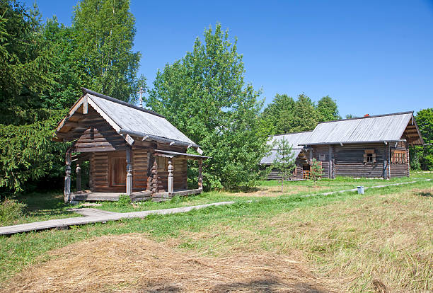 istock ancient log hut on a forest glade. Russia 510583576