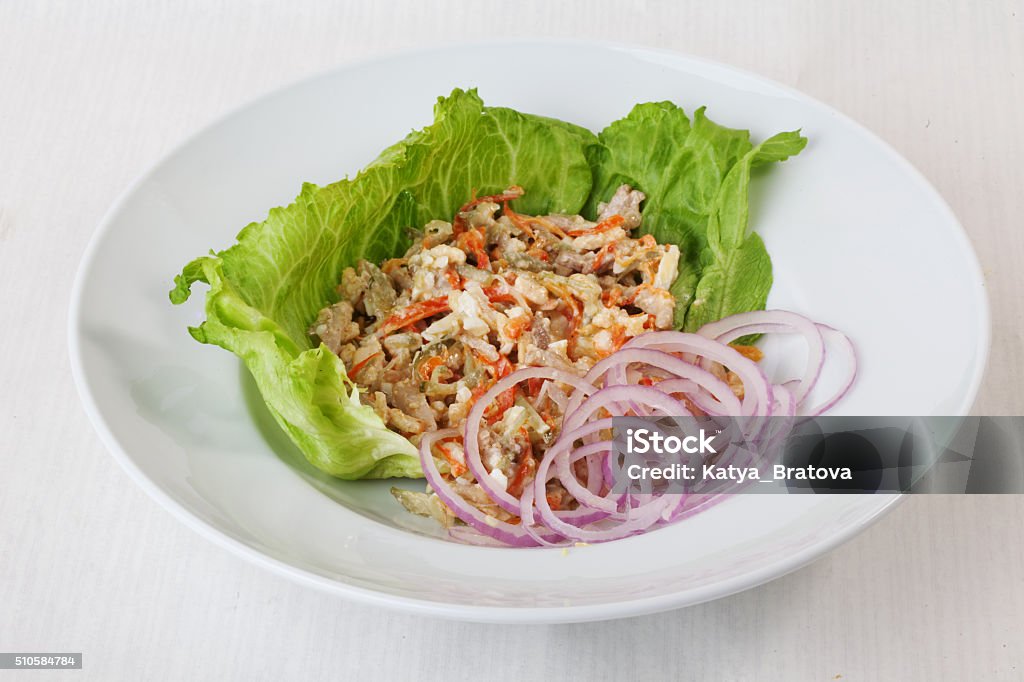 chicken salad, pickled cucumber and carrot on lettuce red onion chicken salad, pickled cucumber and carrot on lettuce red onion round saucer top menu Series ase Appetizer Stock Photo