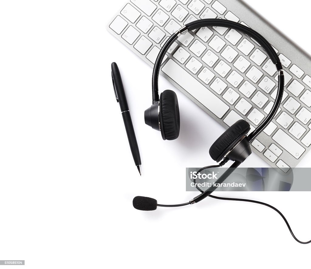 Headset, pen and keyboard Headset, pen and keyboard. Call center support. Isolated on white background Headset Stock Photo