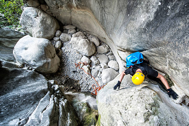 istock Man moving through the gap in the canyon 510585206