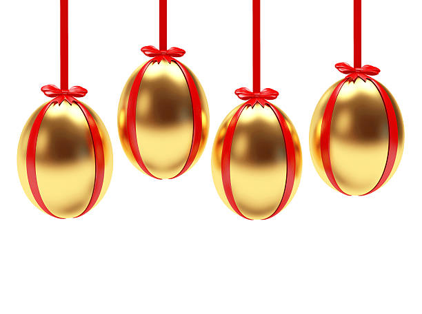 istock Golden Easter eggs hanging on red ribbons with bows 510585832