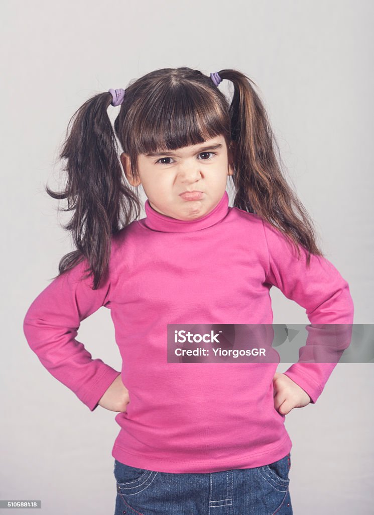 Angry little girl Angry little girl. Toned image with shallow depth of field Girls Stock Photo