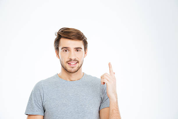 istock Happy man pointing finger up 510588428