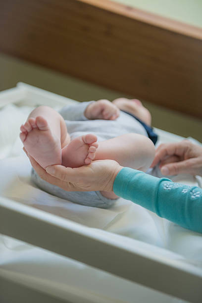 istock Holding baby feet 510589176