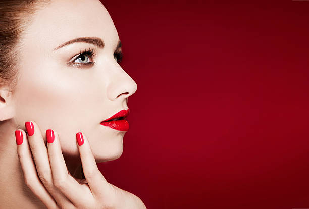 istock Beautiful model profile closeup beauty. Red manicured nails and lips. 510590214