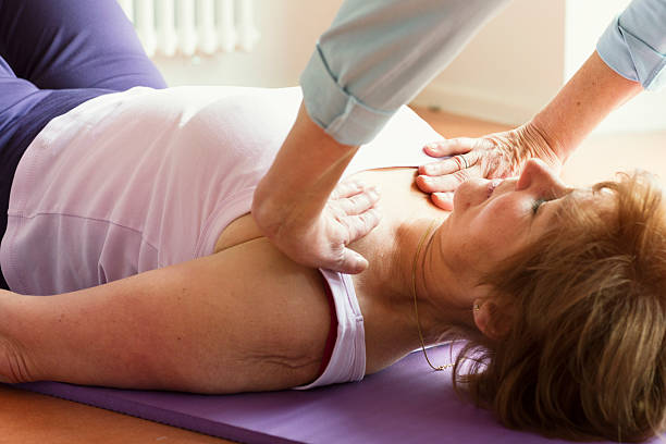istock instructor with active senior women in yoga class 510591950