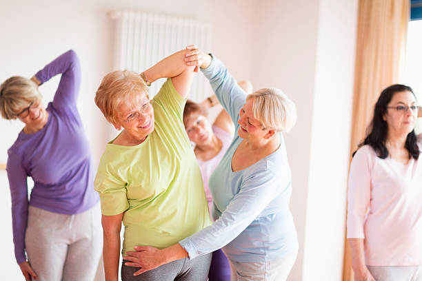 istock instructor with active senior women in yoga class 510609986