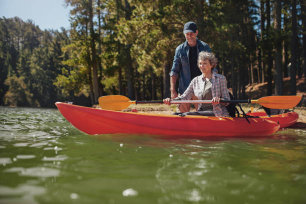 istock Senior woman getting kayaking lessons from a man 510610564