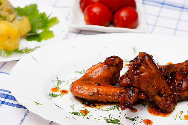 istock chicken grilled with boiled potatoes and pickled tomatoes 510610600