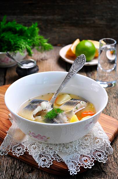 istock Sterlet fish soup with vegetables on wooden background. 510611172