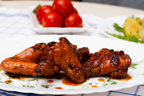 istock chicken  grilled with boiled potatoes and pickled tomatoes 510611450