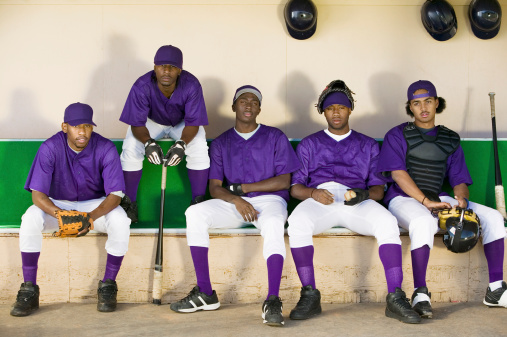 Baseball Team Sitting in Dugout
