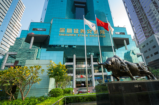 Shenzhen, China - October 29, 2015: The bull sculpture in front of the Building of Shenzhen Stock Exchange.