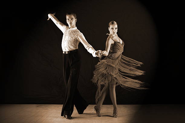 istock dancers in ballroom isolated on black 510613191