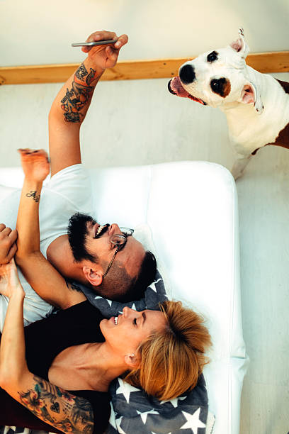 istock Tattooed Couple With Their Dog Taking Selfie 510614204