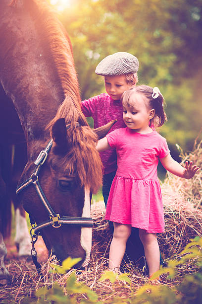 istock Children and a horse 510615408
