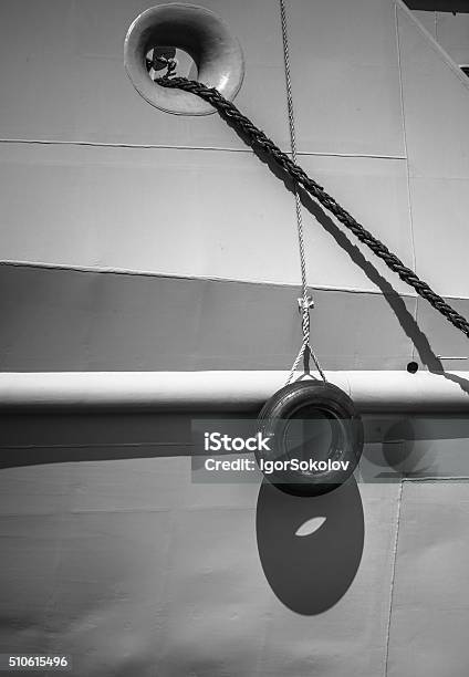 Car Tire Hanging Off The Side Of The Ship Stock Photo - Download Image Now - Bumper, Stability, Backgrounds