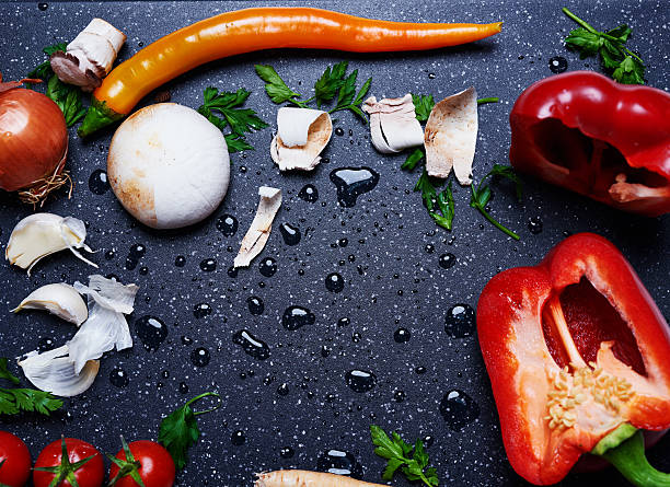 high angle view of fresh vegetables on cutting board.