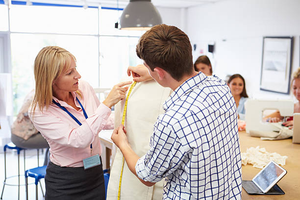 istock Teacher Helping College Students Studying Fashion And Design 510616109