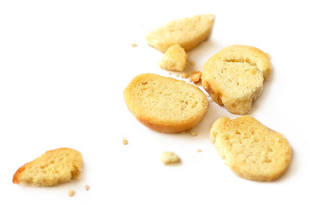 istock Bread and crumbs on white background 510617627