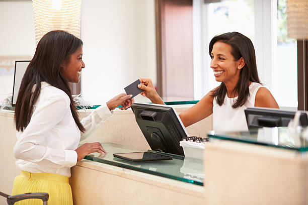 istock Woman Checking In At Hotel Reception 510619255