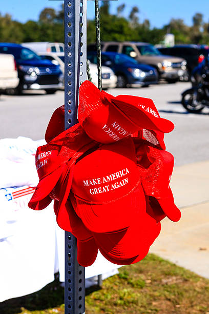 Trump Presidential slogan "Make America Great Again" red baseball hats Sarasota, FL, USA - November 28, 2015: Donald Trump for President "Make America Great Again" red baseball hats on sale at his Presidential candidate tour stop in Sarasota FL donald trump stock pictures, royalty-free photos & images